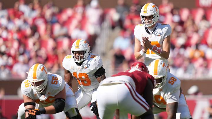 Tennessee quarterback George MacIntyre (12) and running back DeSean Bishop (18) wait for the snap during a college football game against Arkansas at Donald W. Reynolds Razorback Stadium in Fayetteville, Ark., on Oct. 10, 2026. Tennessee quarterback George MacIntyre (12) and running back DeSean Bishop (18) wait for the snap during a college football game against Arkansas at Donald W. Reynolds Razorback Stadium in Fayetteville, Ark., on Oct. 10, 2026.
