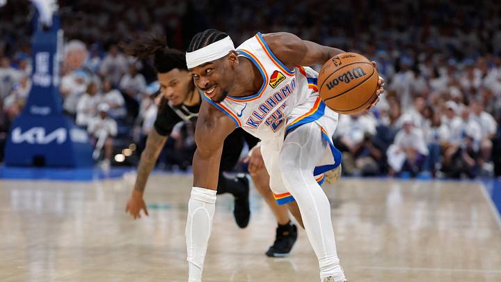 May 26, 2026; Oklahoma City, Oklahoma, USA; Oklahoma City Thunder guard Shai Gilgeous-Alexander (2) dribbles against San Antonio Spurs guard Stephon Castle (5) during the third quarter in game five of the western conference finals for the 2026 NBA playoffs at Paycom Center.