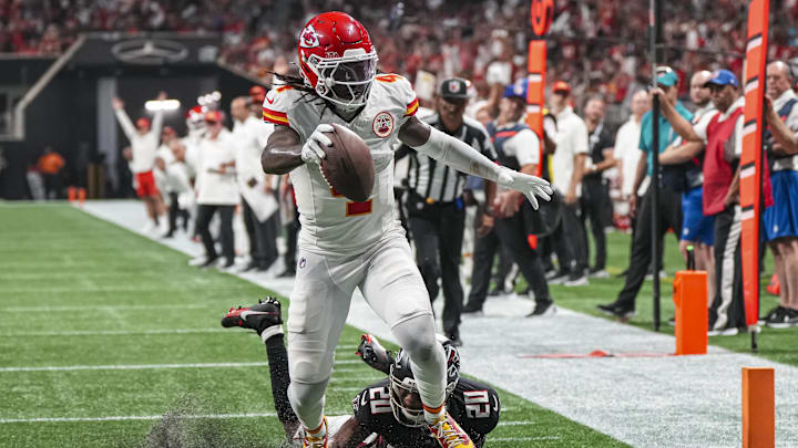 Sep 22, 2024; Atlanta, Georgia, USA; Kansas City Chiefs wide receiver Rashee Rice (4) scores a touchdown past Atlanta Falcons cornerback Dee Alford (20) during the first half at Mercedes-Benz Stadium. Mandatory Credit: Dale Zanine-Imagn Images