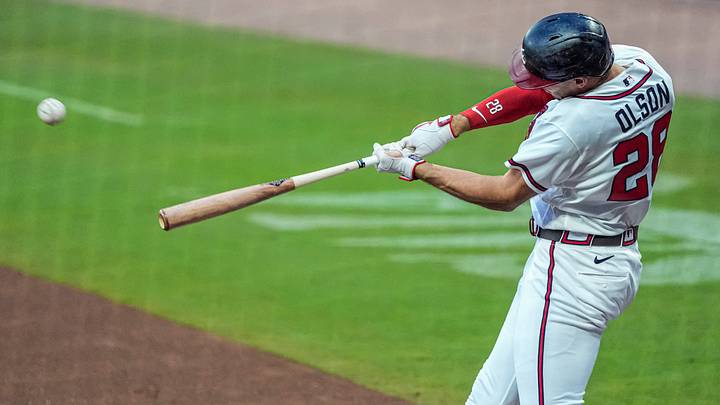 Aug 6, 2026; Cumberland, Georgia, USA; Atlanta Braves first baseman Matt Olson (28) hits a double against the Miami Marlins during the first inning at Truist Park. Mandatory Credit: Dale Zanine-Imagn Images