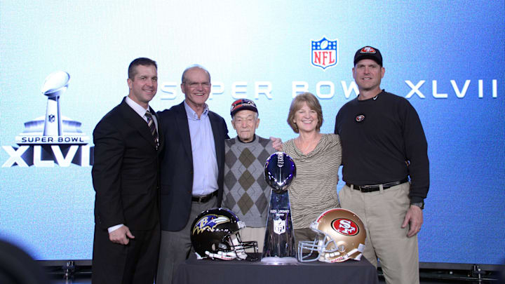 Feb 1, 2013; New Orleans, LA, USA; Baltimore Ravens head coach John Harbaugh (left) poses for a photo with San Francisco 49ers head coach Jim Harbaugh (right) and father Jack Harbaugh (second from left) , grandfather Joe Cipiti (middle) and mother Jackie Harbaugh during a press conference in preparation for Super Bowl XLVII at the New Orleans Convention Center.  Mandatory Credit: Kirby Lee-Imagn Images