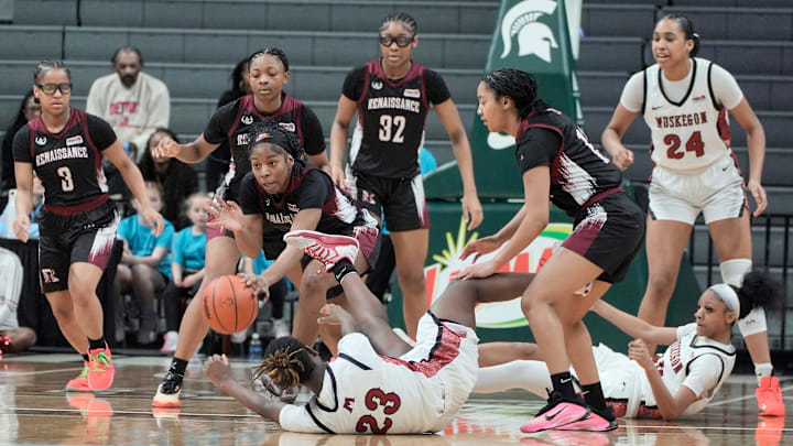 A fight for the ball during first half action in the MHSAA Division 1 girls basketball finals between Muskegon and Detroit Renaissance at the Breslin Center in East Lansing on Saturday, March 21, 2026. 
Muskegon won the game 34-29.