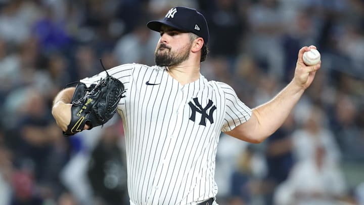 Oct 7, 2025; Bronx, New York, USA; New York Yankees starting pitcher Carlos Rodon (55) pitches against the Toronto Blue Jays in the first inning during game three of the ALDS round for the 2025 MLB playoffs at Yankee Stadium. Mandatory Credit: Wendell Cruz-Imagn Images