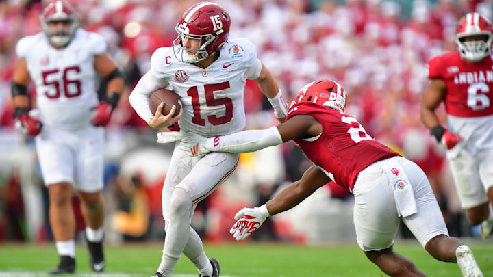Jan 1, 2026; Pasadena, CA, USA; Alabama Crimson Tide quarterback Ty Simpson (15) runs against Indiana Hoosiers linebacker Rolijah Hardy (21) in the first half of the 2026 Rose Bowl and quarterfinal game of the College Football Playoff at Rose Bowl Stadium. Mandatory Credit: Gary A. Vasquez-Imagn Images