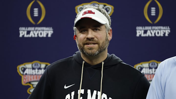 Ole Miss Rebels head coach Pete Golding smiles from the stage after defeating the Georgia Bulldogs during the 2026 Sugar Bowl and quarterfinal game of the College Football Playoff at Caesars Superdome. 