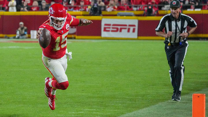 Oct 7, 2024; Kansas City, Missouri, USA; Kansas City Chiefs quarterback Patrick Mahomes (15) runs the ball and dives for a first down against the New Orleans Saints during the second half at GEHA Field at Arrowhead Stadium. Mandatory Credit: Denny Medley-Imagn Images