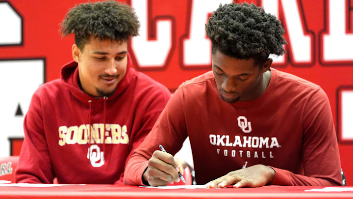 Carl Albert's Marcus James signs with the University of Oklahoma during a signing day ceremony at Carl Albert High School in Midwest City. Carl Albert's Marcus James signs with the University of Oklahoma during a signing day ceremony at Carl Albert High School in Midwest City.