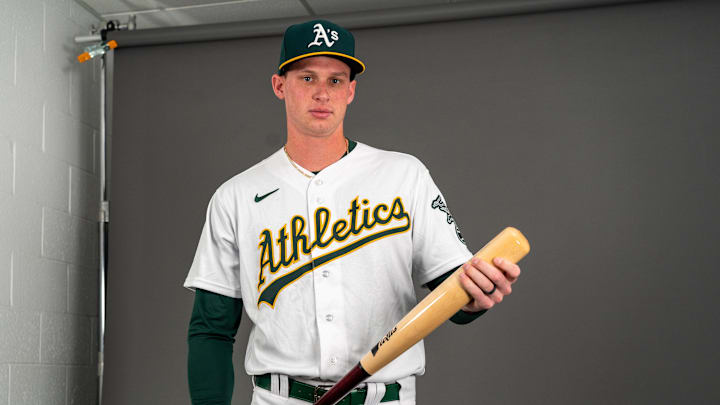 Mesa, AZ, USA; Oakland Athletics infielder Logan Davidson (49) poses for a portrait during spring training photo day at HoHoKam Stadium. Mesa, AZ, USA; Oakland Athletics infielder Logan Davidson (49) poses for a portrait during spring training photo day at HoHoKam Stadium.