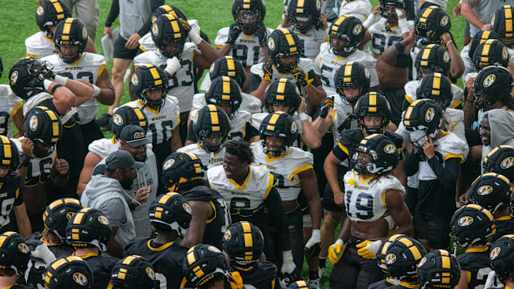 Aug 18, 2025; Columbia, MO, USA; Missouri Tigers defensive ends Zion Young (9) and Darris Smith (19) break down a fall camp practice.