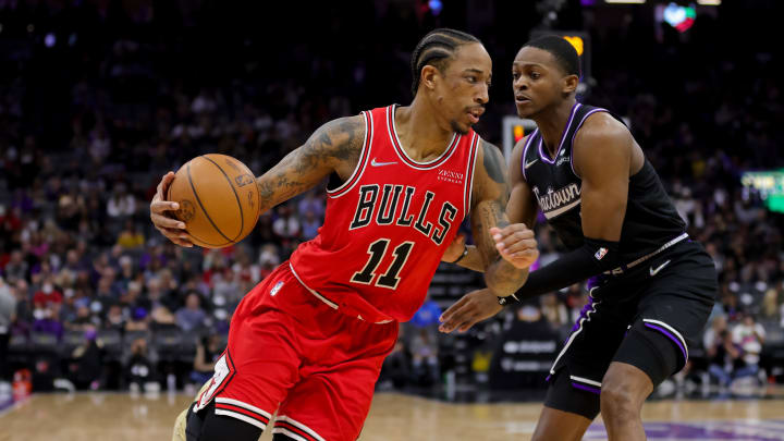 Mar 14, 2022; Sacramento, California, USA; Chicago Bulls forward DeMar DeRozan (11) dribbles the ball around Sacramento Kings guard De'Aaron Fox (5) during the third quarter at Golden 1 Center. Mandatory Credit: Sergio Estrada-USA TODAY Sports