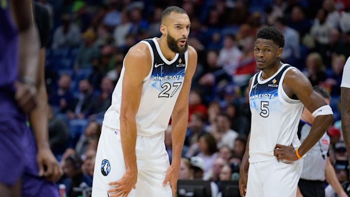 Minnesota Timberwolves center Gobert talks with guard Edwards against the New Orleans Pelicans during the first half at Smoothie King Center. 