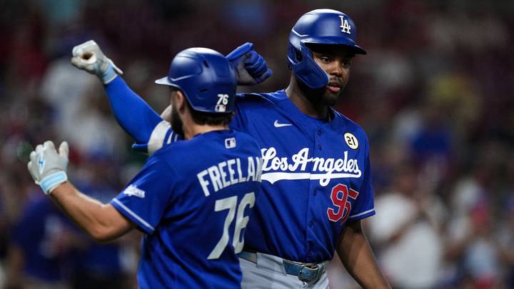 Sep 15, 2026; Cincinnati, Ohio, USA; Los Angeles Dodgers second baseman Alex Freeland (76) celebrates with designated hitter Josue de Paula (95) after hitting a solo home run against the Cincinnati Reds in the seventh inning at Great American Ball Park. Mandatory Credit: Aaron Doster-Imagn Images Sep 15, 2026; Cincinnati, Ohio, USA; Los Angeles Dodgers second baseman Alex Freeland (76) celebrates with designated hitter Josue de Paula (95) after hitting a solo home run against the Cincinnati Reds in the seventh inning at Great American Ball Park. Mandatory Credit: Aaron Doster-Imagn Images