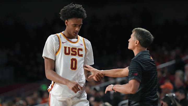 Feb 18, 2026; Los Angeles, California, USA; Southern California Trojans head coach Eric Musselman and guard Alijah Arenas (0) react against the Illinois Fighting Illini in the first half at Galen Center.