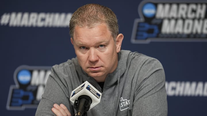 Mar 19, 2025; Lexington, KY, USA;  Utah State head coach Jerrod Calhoun talks with media during NCAA Tournament First Round Practice at Rupp Arena. Mandatory Credit: Aaron Doster-Imagn Images