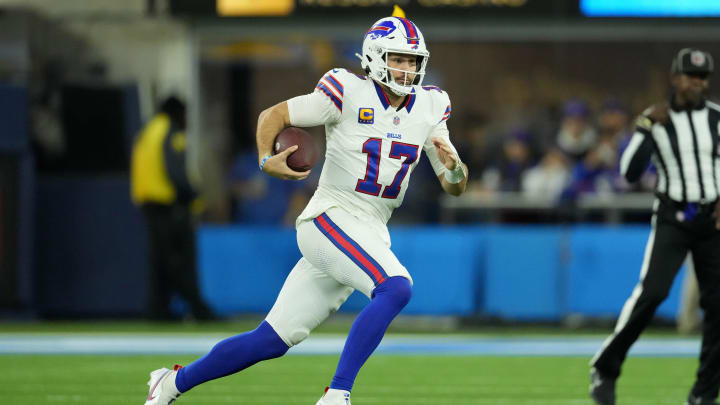 Dec 23, 2023; Inglewood, California, USA; Buffalo Bills quarterback Josh Allen (17) carries the ball against the Los Angeles Chargers in the first half at SoFi Stadium. Mandatory Credit: Kirby Lee-USA TODAY Sports