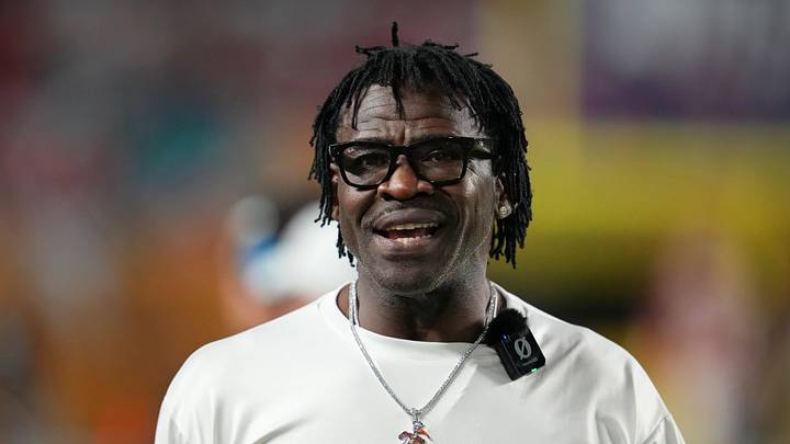 Jan 19, 2026; Miami Gardens, FL, USA; Miami Hurricanes former player Michael Irvin walks on the sideline during halftime of the College Football Playoff National Championship game at Hard Rock Stadium. Mandatory Credit: Kirby Lee-Imagn Images