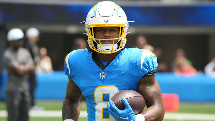 Aug 10, 2025; Inglewood, California, USA; Los Angeles Chargers running back Omarion Hampton (8) carries the ball before the game against the New Orleans Saints at SoFi Stadium. Mandatory Credit: Kirby Lee-Imagn Images