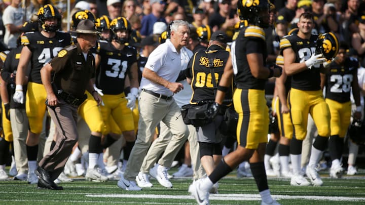 Iowa’s head football coach Kirk Ferentz runs onto the field after defeating Washington for his 200th career win at Iowa Saturday, Oct. 12, 2024 at Kinnick Stadium in Iowa City, Iowa. Iowa’s head football coach Kirk Ferentz runs onto the field after defeating Washington for his 200th career win at Iowa Saturday, Oct. 12, 2024 at Kinnick Stadium in Iowa City, Iowa.