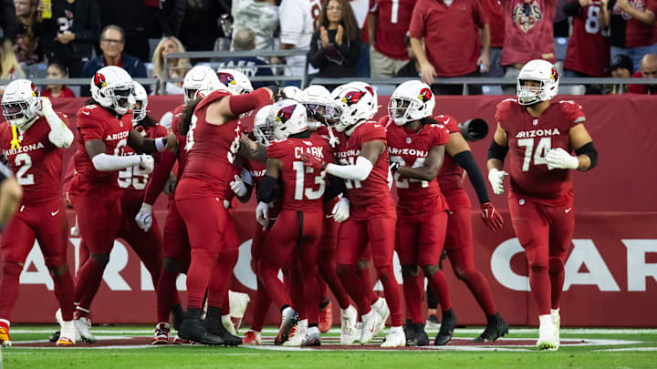 Jan 5, 2025; Glendale, Arizona, USA; Arizona Cardinals cornerback Kei'Trel Clark (13) celebrates an interception with teammates against the San Francisco 49ers in the second half at State Farm Stadium. Mandatory Credit: Mark J. Rebilas-Imagn Images