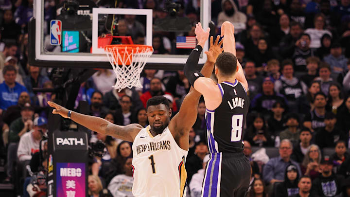 Feb 8, 2025; Sacramento, California, USA; Sacramento Kings guard Zach LaVine (8) scores a basket against New Orleans Pelicans forward Zion Williamson (1) during the third quarter at Golden 1 Center. Mandatory Credit: Kelley L Cox-Imagn Images