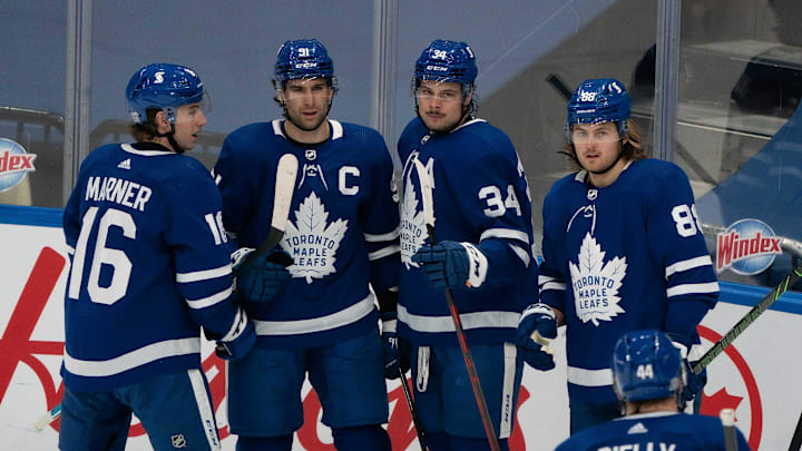 Feb 15, 2021; Toronto, Ontario, CAN; Toronto Maple Leafs center Auston Matthews (34) celebrates scoring a goal with Toronto Maple Leafs center Mitchell Marner (16) and Toronto Maple Leafs center John Tavares (91) and Toronto Maple Leafs center William Nylander (88) during the second period against the Ottawa Senators at Scotiabank Arena. Mandatory Credit: Nick Turchiaro-USA TODAY Sports