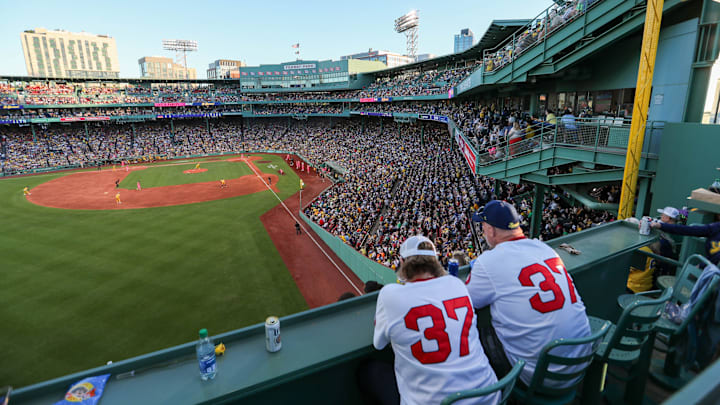 Saturday, June 8, 2024; Boston MA-Fans watch the game from the top of the Green Monster during the Savannah Bananas first Banana Ball game at Fenway Park on Saturday, June 8, 2024.