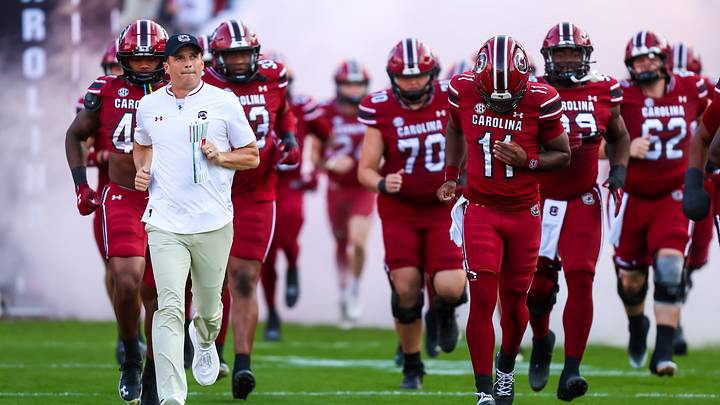 Nov 22, 2025; Columbia, South Carolina, USA; South Carolina Gamecocks head coach Shane Beamer leads his team onto the field before their game against the Coastal Carolina Chanticleers at Williams-Brice Stadium. Mandatory Credit: Jeff Blake-Imagn Images