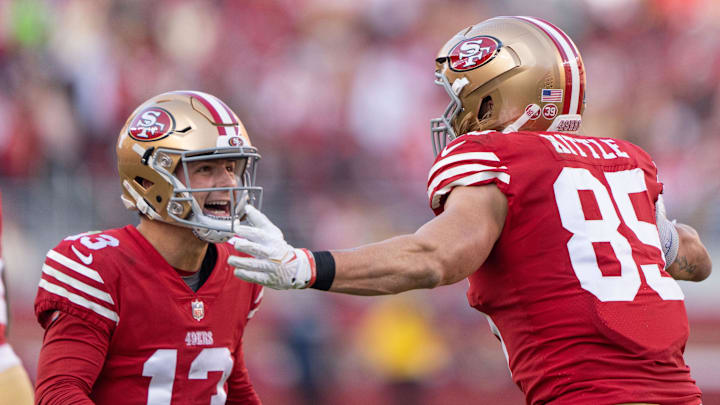 San Francisco 49ers quarterback Brock Purdy (13) and tight end George Kittle (85) celebrate during the third quarter against the Washington Commanders at Levi's Stadium.