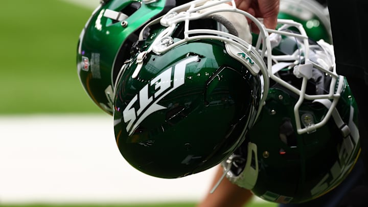 Oct 6, 2024; Tottenham, ENG; New York Jets helmets are held by staff before the match against Minnesota Vikings at Tottenham Hotspur Stadium. Mandatory Credit: Shaun Brooks-Imagn Images Oct 6, 2024; Tottenham, ENG; New York Jets helmets are held by staff before the match against Minnesota Vikings at Tottenham Hotspur Stadium. Mandatory Credit: Shaun Brooks-Imagn Images