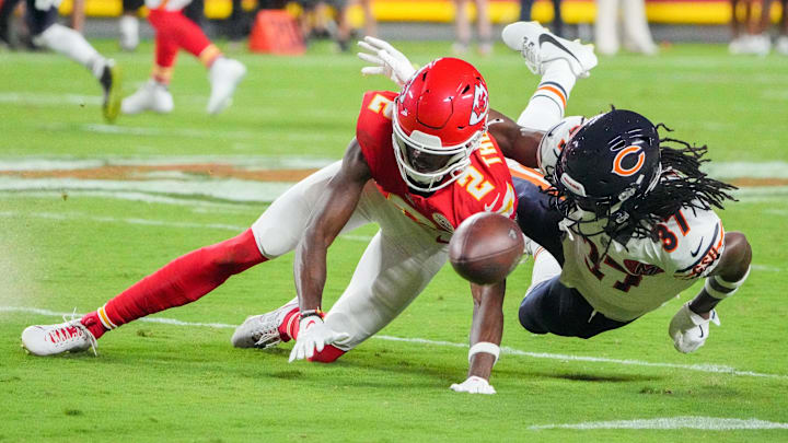 Chicago Bears cornerback Tre Flowers (37) breaks up a pass intended for Kansas City Chiefs wide receiver Tyquan Thornton (2) during the first half of the game at GEHA Field at Arrowhead Stadium.