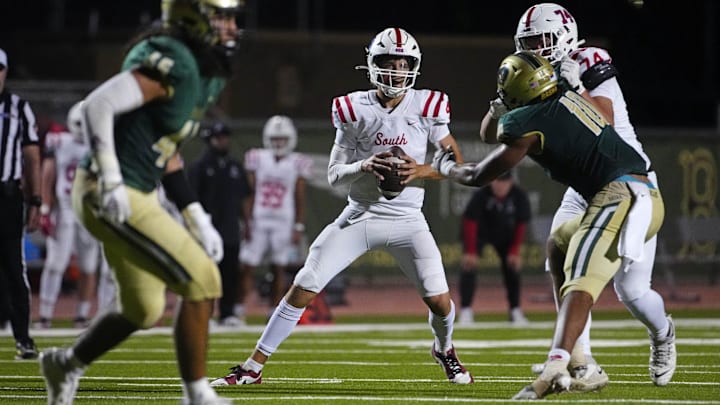 Millard South Jett Thomalla (4) looks for receivers against Basha during a game at Basha High School in Chandler on Aug. 30, 2024. Millard South Jett Thomalla (4) looks for receivers against Basha during a game at Basha High School in Chandler on Aug. 30, 2024.