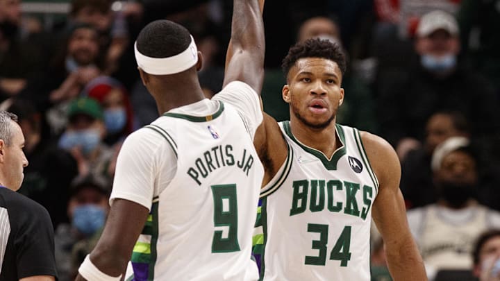 Jan 19, 2022; Milwaukee, Wisconsin, USA;  Milwaukee Bucks forward Giannis Antetokounmpo (34) high fives forward Bobby Portis (9) during the first quarter against the Memphis Grizzlies at Fiserv Forum. Mandatory Credit: Jeff Hanisch-Imagn Images