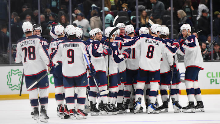 The Columbus Blue Jackets celebrate after defeating the Seattle Kraken during a shootout at Climate Pledge Arena
