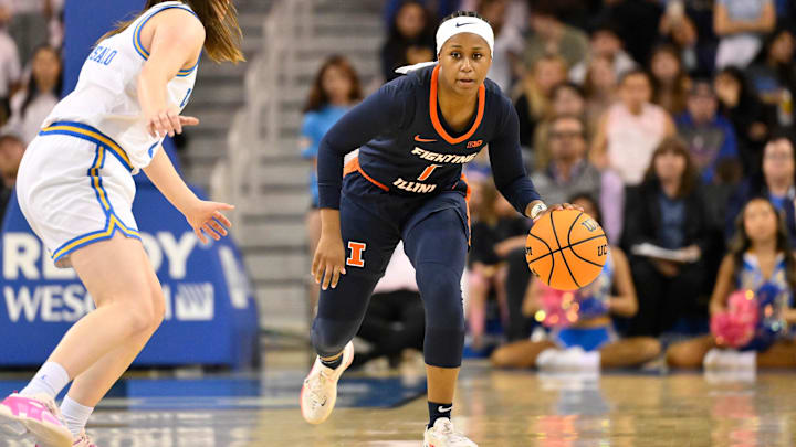 Feb 20, 2025; Los Angeles, California, USA; Illinois Fighting Illini guard Genesis Bryant (1) dribbles the ball up the court as UCLA Bruins guard Elina Aarnisalo (7) defend during the second quarter at Pauley Pavilion presented by Wescom. Mandatory Credit: Robert Hanashiro-Imagn Images