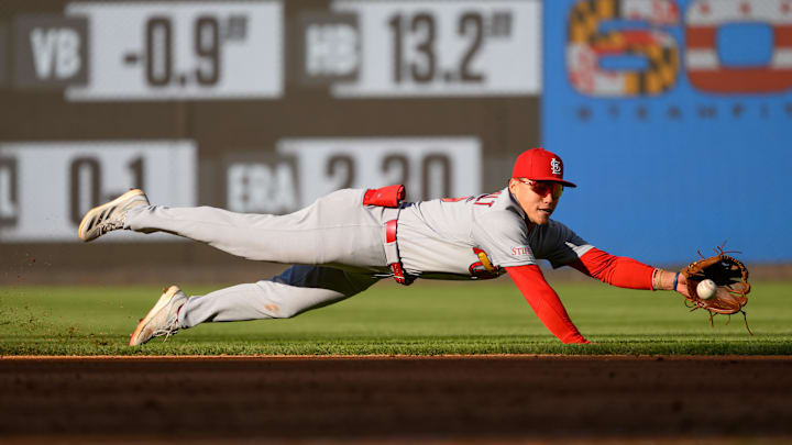 Apr 8, 2026; Washington, District of Columbia, USA; St. Louis Cardinals shortstop JJ Wetherholt (26) dives to field a ground ball against the Washington Nationals during the sixth inning at Nationals Park. Mandatory Credit: Rafael Suanes-Imagn Images