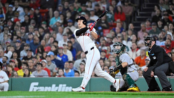 Sep 17, 2025; Boston, Massachusetts, USA; Boston Red Sox right fielder Rob Refsnyder (30) hits a one run home run against the Athletics during the second inning at Fenway Park. Mandatory Credit: Eric Canha-Imagn Images