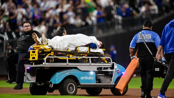 Sep 17, 2026; New York City, New York, USA;  New York Mets first baseman Jared Young (29) is taken off the field by EMS workers after an injury at first base during the sixth inning against the Philadelphia Phillies at Citi Field.  Mandatory Credit: John Jones-Imagn Images