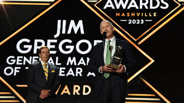 Jun 28, 2023; Nashville, Tennessee, USA; Dallas Stars general manager Jim Nill is awarded the Jim Gregory General Manager of the Year award by Nashville Predators general manager David Poile during the first round of the 2023 NHL Draft at Bridgestone Arena. Mandatory Credit: Christopher Hanewinckel-Imagn Images