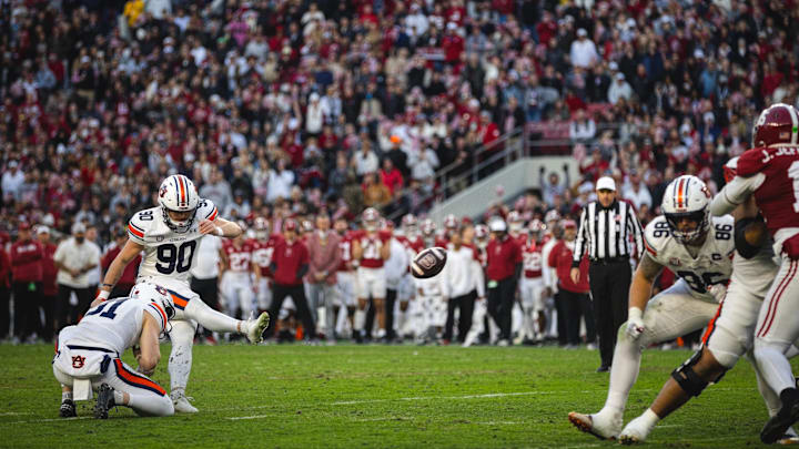 Nov 30, 2024; Tuscaloosa, Alabama, USA; Auburn Tigers place kicker Ian Vachon (90) kicks for a field goal against the Alabama Crimson Tide during the second quarter at Bryant-Denny Stadium. Mandatory Credit: Will McLelland-Imagn Images