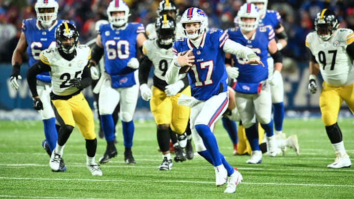 Jan 15, 2024; Orchard Park, New York, USA; Buffalo Bills quarterback Josh Allen (17) runs the ball in the first half against the Pittsburgh Steelers in a 2024 AFC wild card game at Highmark Stadium