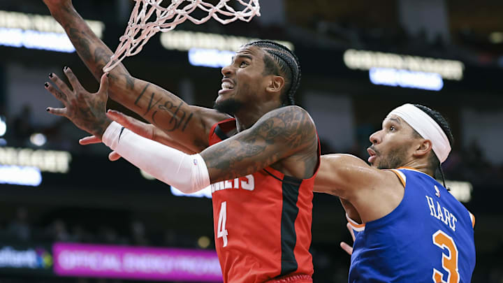 Nov 4, 2024; Houston, Texas, USA; Houston Rockets guard Jalen Green (4) attempts to score a basket as New York Knicks guard Josh Hart (3) defends during the second quarter at Toyota Center. Mandatory Credit: Troy Taormina-Imagn Images
