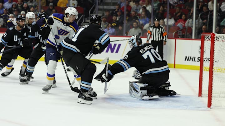 Sep 22, 2024; Des Moines, Iowa, USA;  Utah Hockey Club goaltender Karel Vejmelka (70) makes a save against the St. Louis Blues at Wells Fargo Arena. Mandatory Credit: Reese Strickland-Imagn Images


