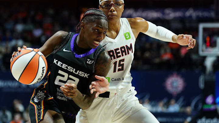 Connecticut Sun guard Saniya Rivers (22) drives the ball against Atlanta Dream guard Allisha Gray (15) in the second half at Mohegan Sun Arena. 