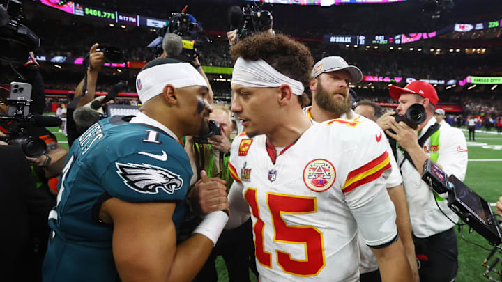 Philadelphia Eagles quarterback Jalen Hurts (1) shakes hands with Kansas City Chiefs quarterback Patrick Mahomes (15) after Super Bowl LIX at Ceasars Superdome.