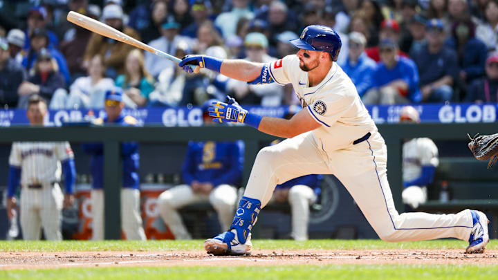 Seattle Mariners catcher Cal Raleigh hits a home run during a game against the Texas Rangers on April 11 at T-Mobile Park.