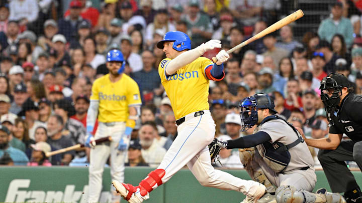 Sep 13, 2025; Boston, Massachusetts, USA; Boston Red Sox third baseman Alex Bregman (2) hits a home run against the New York Yankees during fifth inning inning at Fenway Park. Mandatory Credit: Eric Canha-Imagn Images