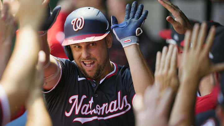 Aug 13, 2025; Kansas City, Missouri, USA; Washington Nationals first baseman Nathaniel Lowe (33) is congratulated by teammates after a grand slam during the first inning against the Kansas City Royals at Kauffman Stadium