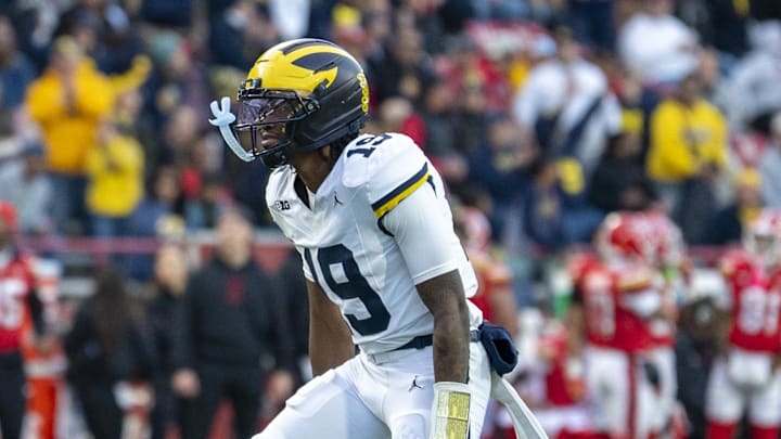 Nov 22, 2025; College Park, Maryland, USA; Michigan Wolverines quarterback Bryce Underwood (19) reacts after throwing a first half touchdown against the Maryland Terrapins  at SECU Stadium. Mandatory Credit: Tommy Gilligan-Imagn Images