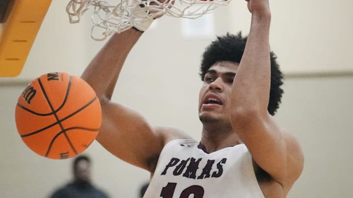 Perry Pumas forward Koa Peat (10) dunks the ball against the Sandra Day O'Connor Eagles during their boys basketball state semifinals game at Chaparral High School in Phoenix on March 5, 2025.