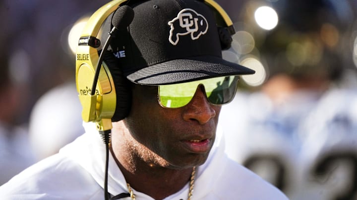 Colorado Buffaloes head coach Deion Sanders walks the sidelines as his team takes on the ASU Sun Devils at Mountain America Stadium.